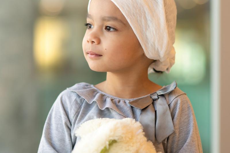 Close up of a young girl with teddy bear