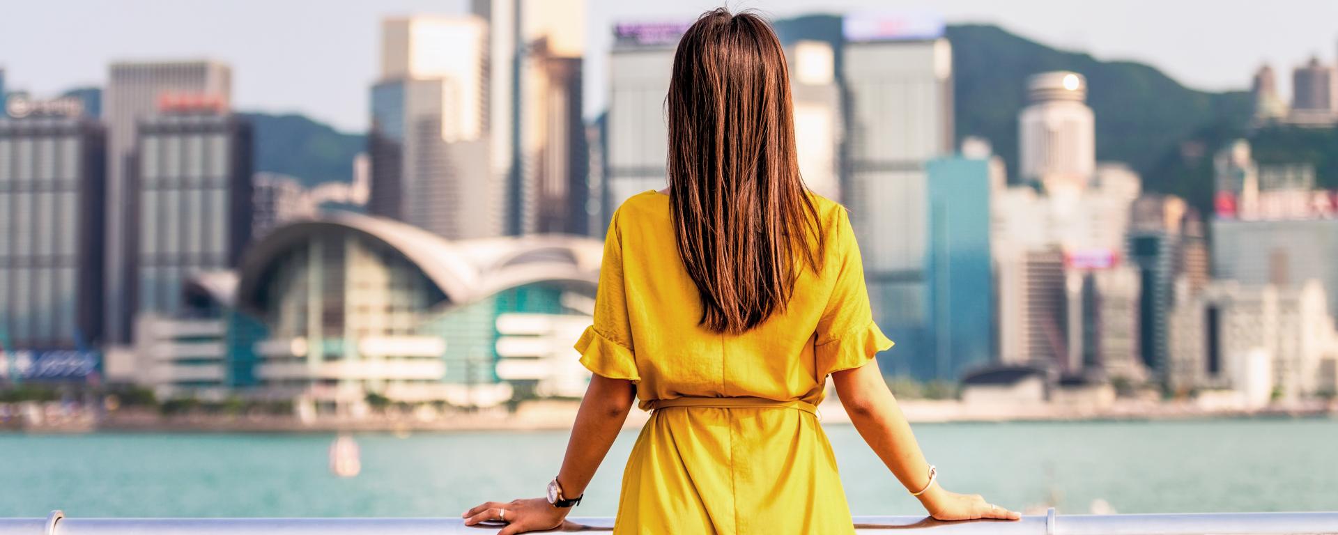 Woman looking out over a city