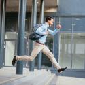 Man jumping with backpack