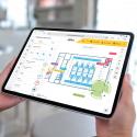 Tablet in hands with 极速赛车 Site Designer running