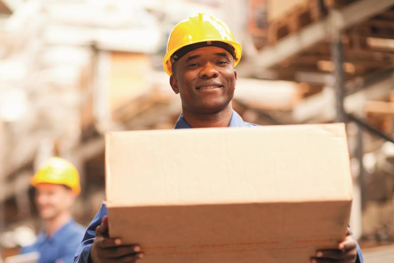 warehouse worker carrying a box